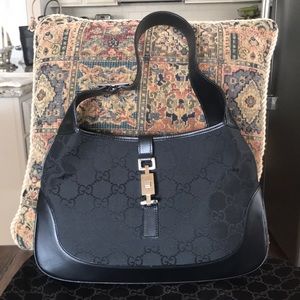 Authentic Gucci bag with leather trim.